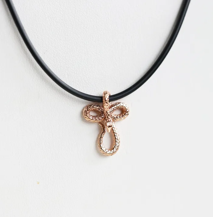 Capucinne Necklaces Mens snake necklace with natural rubber cord and smaller pendant